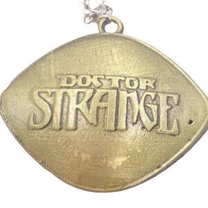 Unisex antique gold tone Doctor Strange pendant necklace
